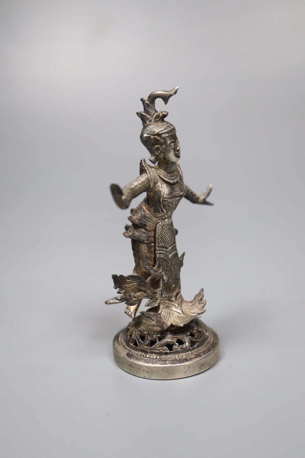 A small Burmese white metal figural table decoration, 9cm, 88 grams.